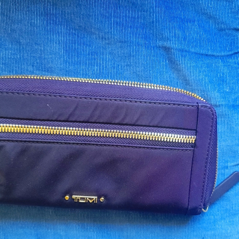 Purple Tumi wallet